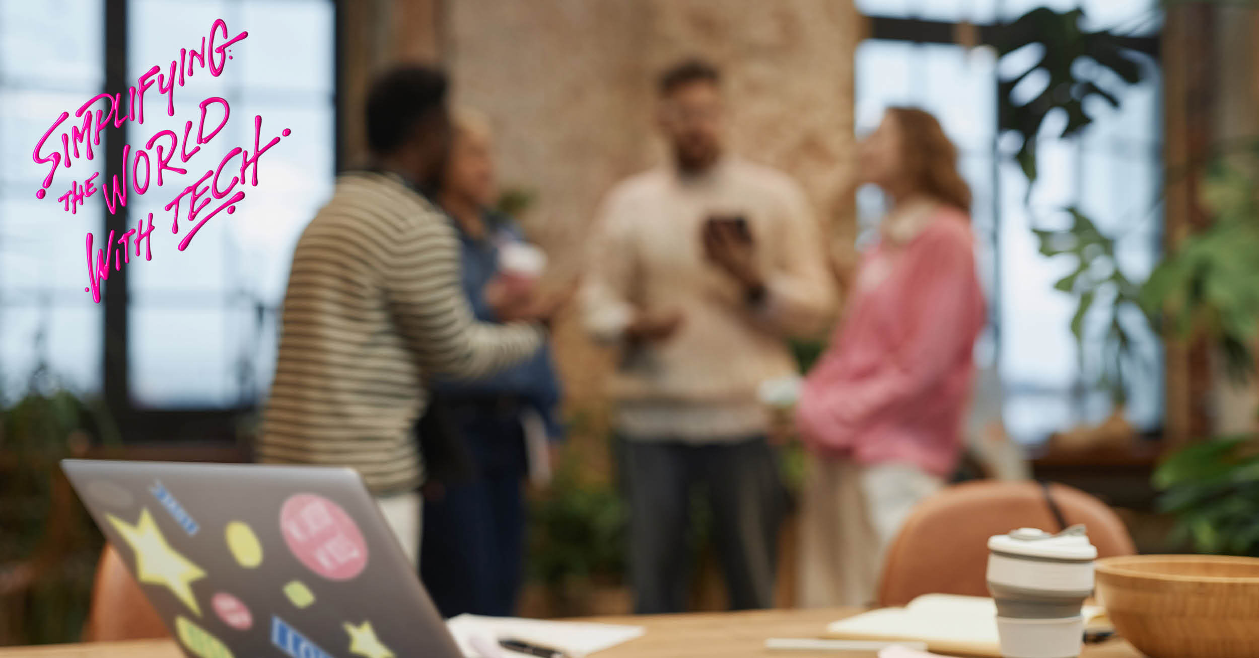 Blurred image of people gathered together at work